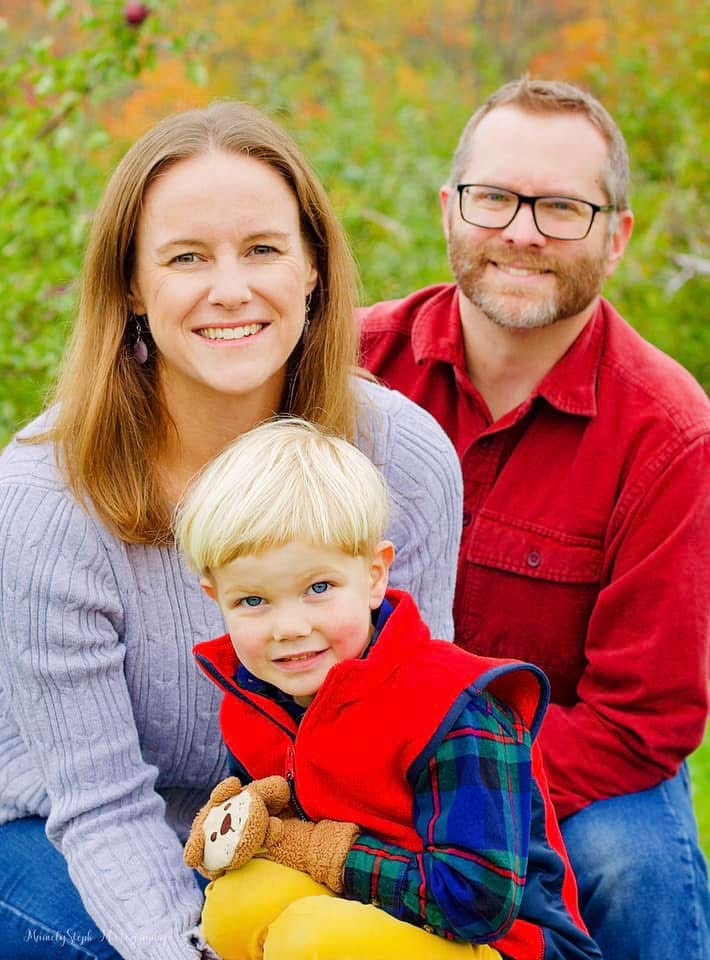 Family session in apple orchard